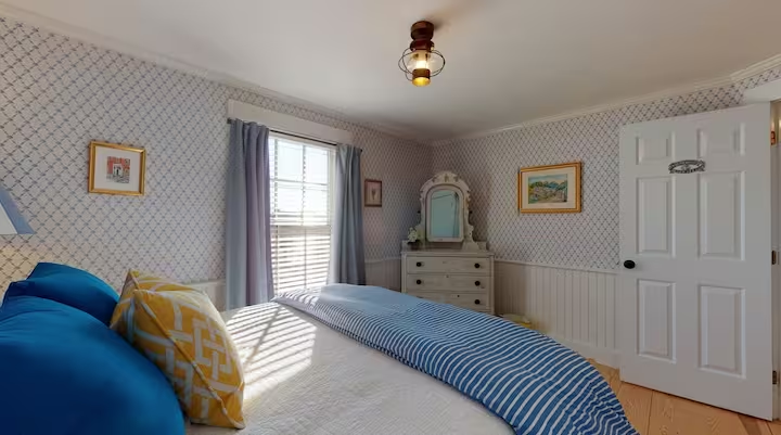 The vanity set beside the bed in the same room.