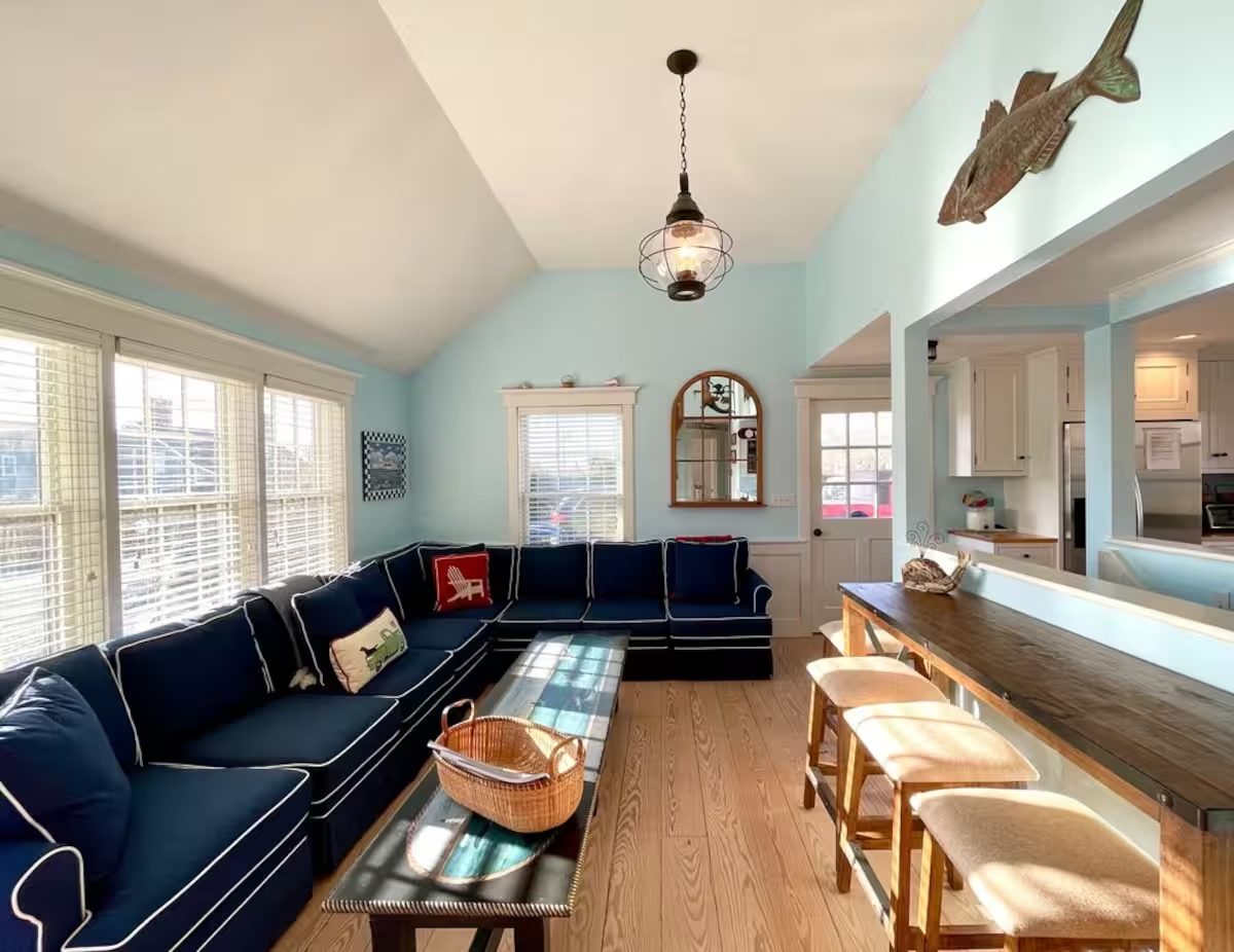 Crew's living room with deep upholstered seating arranged around the centre of the room.